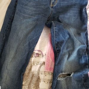 A pair of ripped blue jeans